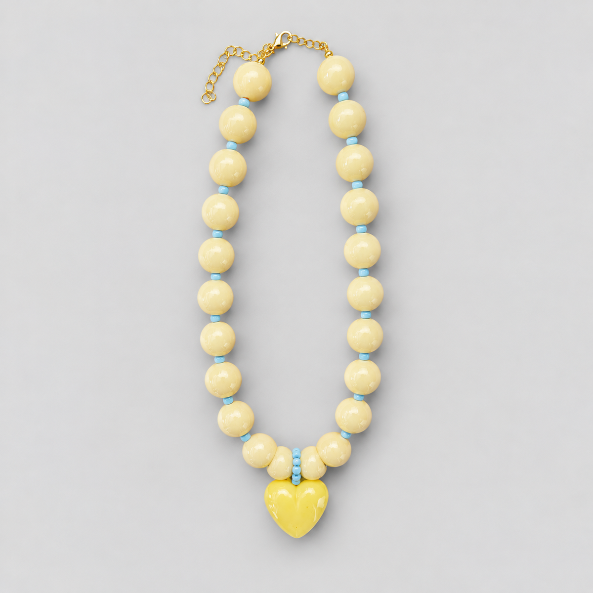 Collar corazón miel amariillo