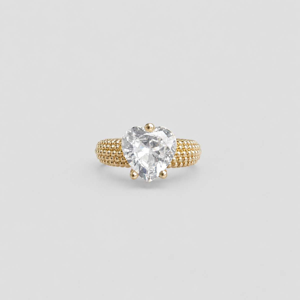 Anillo corazón perlado dorado