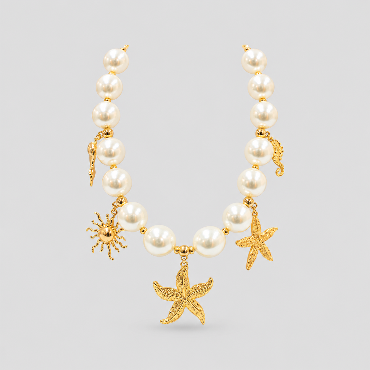 Collar + topos aura marina perla dorado