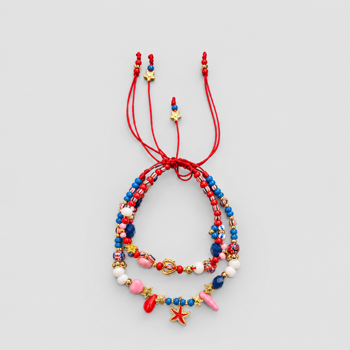 Tobillera estrella de mar x2 rojo y azul