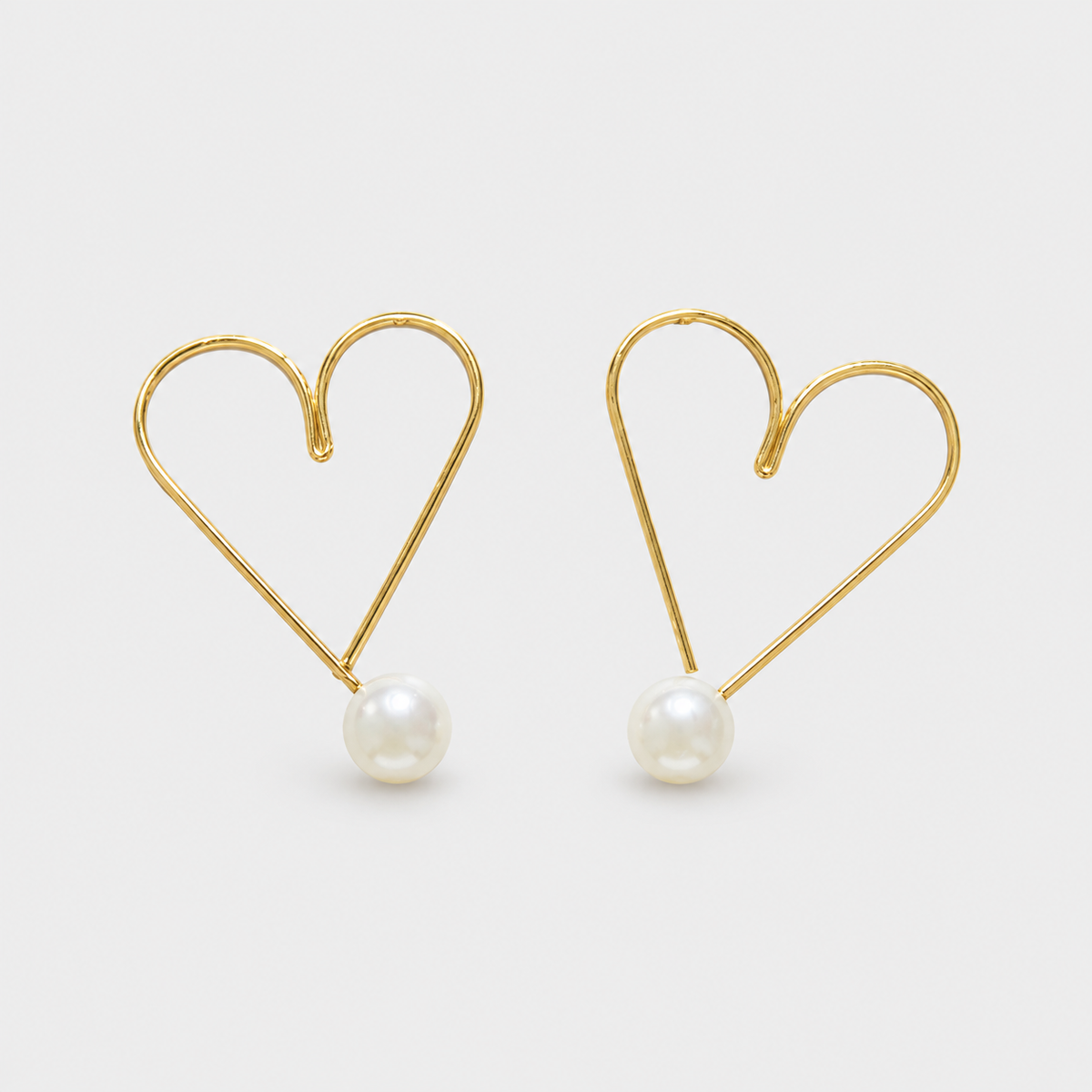 Aretes corazón perla dorado