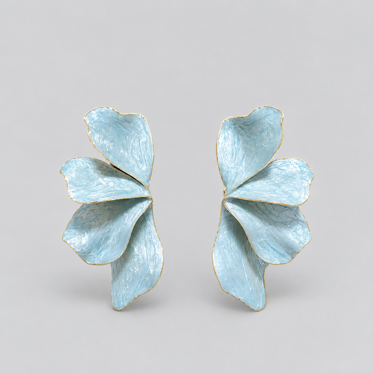 Aretes alas de esmeralda azul